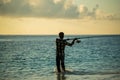 An Angler Fishing on beach