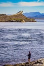 Angler with fishing rod on Atlantic road, Norway