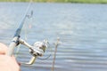 Angler fishing with a rod and spinning reel Royalty Free Stock Photo
