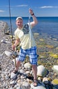 Angler with garfish Royalty Free Stock Photo