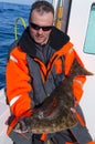 Angler with halibut Royalty Free Stock Photo