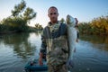 Angler holds big Asp fish Royalty Free Stock Photo