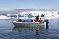 Angler between Icebergs, Greenland Royalty Free Stock Photo