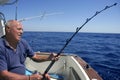Angler senior big game sport fishing boat Royalty Free Stock Photo