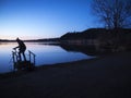 Angler silhouette at the Lake Hopfen