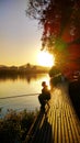 Under the setting sun By the moat An angler Royalty Free Stock Photo