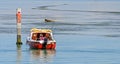 Boat of an angler on blue water