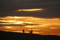 Anglers on Chesil Bank at sunset Royalty Free Stock Photo