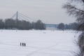 Anglers with equipment are fishing on the river Dnipro on ice in winter day. Fishermen. Kyiv, Ukraine Royalty Free Stock Photo