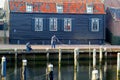 Anglers are fishing in the traditional fishing village Spakenburg, Netherlands