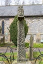 Anglo-Saxon Stone Cross in a churchyard at Eyam