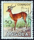 ANGOLA - CIRCA 1953: A stamp printed in Angola from the `Angolan fauna` issue shows an Impala, circa 1953.