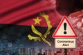Angola flag and Coronavirus 2019-nCoV alert sign. Concept of high probability of novel coronavirus outbreak through traveling Royalty Free Stock Photo