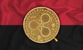 Angola, flag, ripple gold coin on flag background. The concept of blockchain, bitcoin, currency decentralization in the country.