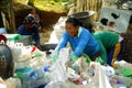 Workers of a materials recovery facility sort through plastic waste and segregate them for proper recycling Royalty Free Stock Photo