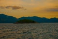 Angra dos Reis, Brazil, Ilha Grande: Beautiful scenery with ships overlooking the sea and mountains at sunset