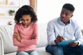 Angry african american girl having conversation with child psychologist Royalty Free Stock Photo