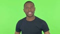 Angry Young African Man Abusing on Green Background