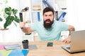 Angry aggressive businessman in office. Frustrated office worker holding hammer poised ready to smash. Office life makes