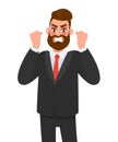 Angry aggressive, frustrated businessman raising fists. Man shouting out loud. Evil, negative, bad facial expression. Royalty Free Stock Photo