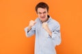 Angry aggressive man standing clenched fists and being ready to attack, fighting, looking at camera. Royalty Free Stock Photo