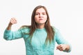 Angry aggressive woman with ferocious expression on white background