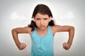 Angry and aggressive young girl with steam blowing out of her ears