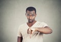 Angry annoyed, grumpy man giving thumbs down gesture Royalty Free Stock Photo