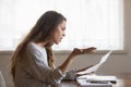 Angry annoyed woman reading bad news in letter, holding paper Royalty Free Stock Photo