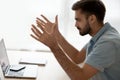 Angry annoyed young man mad about computer problem at work Royalty Free Stock Photo