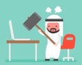 Angry Arab businessman carrying hammer to destroy laptop on desk Royalty Free Stock Photo