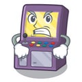 Angry arcade machine next to mascot table Royalty Free Stock Photo