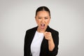 Angry Asian businesswoman pointing accusingly with a furious expression Royalty Free Stock Photo