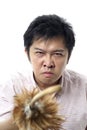 Angry asian with feather cane