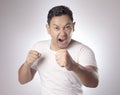 Angry Asian Man Expression Ready to Fight Royalty Free Stock Photo