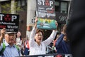 Angry Asian protesters march while holding signs to stop the release of Fukushima radioactive waste water into the ocean