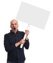 Angry bald man is holding a blank placard on a stick