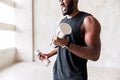 Angry bearded sportsman making muscle-building exercises