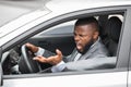 Angry black driver fighting on the road, stuck in traffic Royalty Free Stock Photo