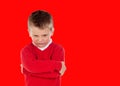 Angry blond child with red jersey