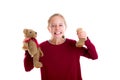 Angry blond girl with broken teddy bear