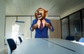 Angry boss concept with lion in the suit near desk Royalty Free Stock Photo