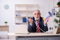 Angry boss holding megaphone at workplace Royalty Free Stock Photo