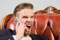 Angry boss. Man well groomed shout aggressively mobile phone grey background. Businessman angry call mobile phone