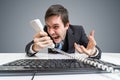 Angry boss or manager is calling and shouting to the telephone