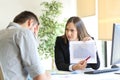 Angry boss scolding to an employee Royalty Free Stock Photo