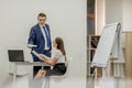 Angry boss yelling at his young employee, she is stressed and feeling frustrated: hostile boss and mobbing concept Royalty Free Stock Photo