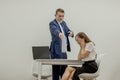 Angry boss yelling at his young employee, she is stressed and feeling frustrated: hostile boss and mobbing concept Royalty Free Stock Photo