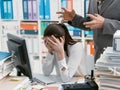 Angry boss yelling at his young employee Royalty Free Stock Photo