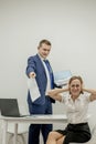 Angry boss yelling at his young employee, she is stressed and feeling frustrated: hostile boss and mobbing concept Royalty Free Stock Photo